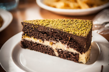 Delicious chocolate Brownie with pistachio crump on top