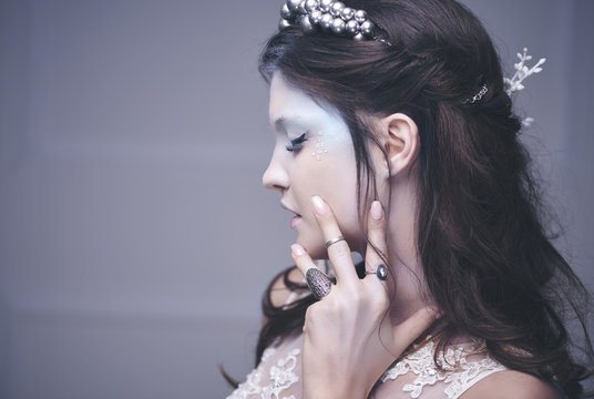 Side view of ice queen's human face