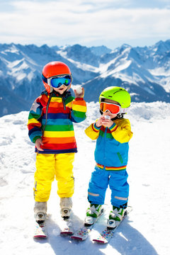 Ski and snow winter fun for kids. Children skiing.