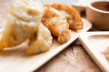 Gyoza dumplings in wooden plate