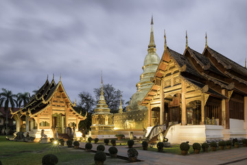 Wat Phra Sing in Chiang Mai, Thailand on a cloudy and cool January evening.