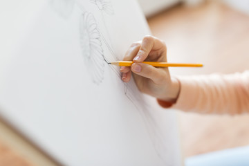 artist with pencil drawing picture at art studio