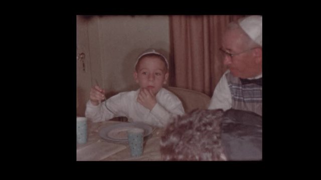 1959 Jewish family eating at Passover seder