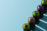 top view of arranged cans with aerosol paint isolated on blue