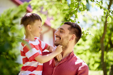 happy father and son at summer garden