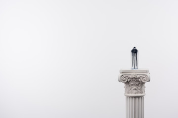 close up view of spray paint in can standing on column isolated on white