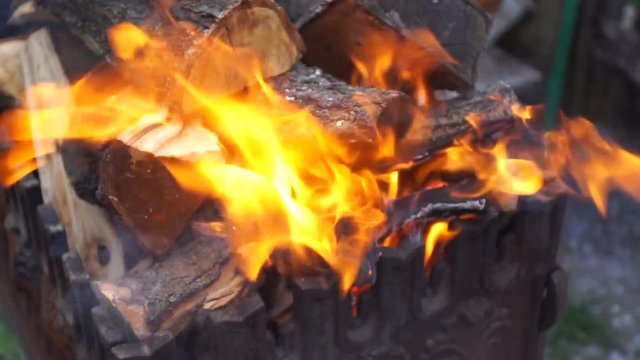 Wood burning in a cast iron grill