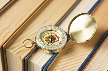 compass and old books