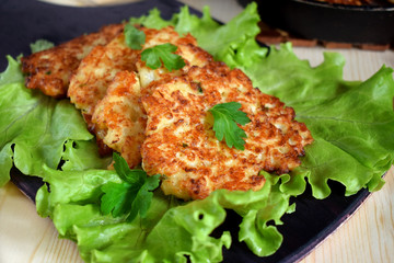 Vegetable pancakes on lettuce leaves. Vegetarian meal