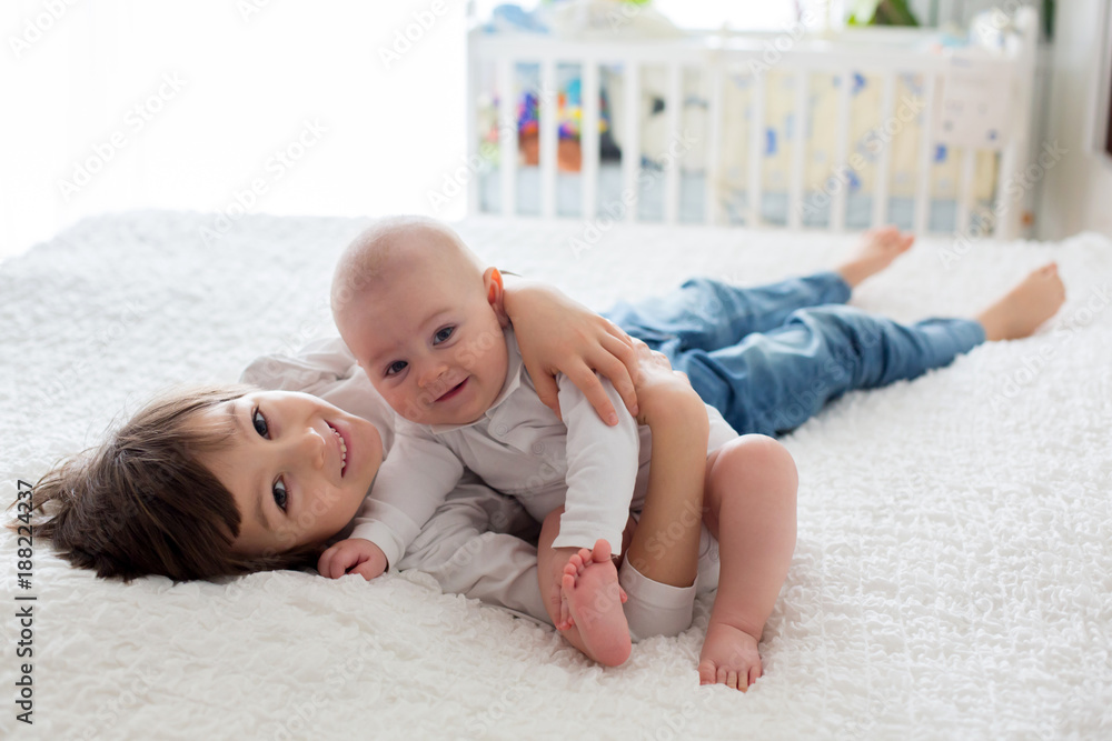 Canvas Prints Little toddler boy, playing with his little brother at home