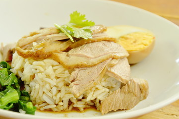 boiled duck meat slice dressing brown sauce with pickled cabbage on rice
