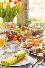 Table with delicatessen ready for Easter brunch