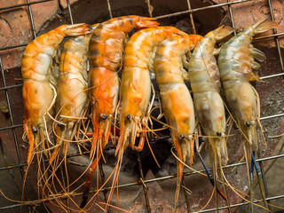 Top view of grilled shrimps (Giant Malaysian Prawn) on flaming grill