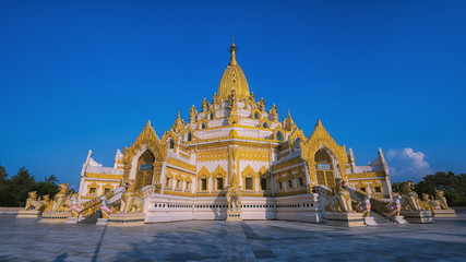 golden pagoda with blue sky in Myanmar