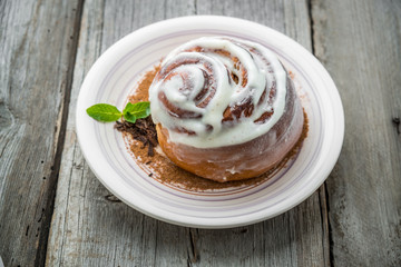 Cinnamon rolls with almond on the table.