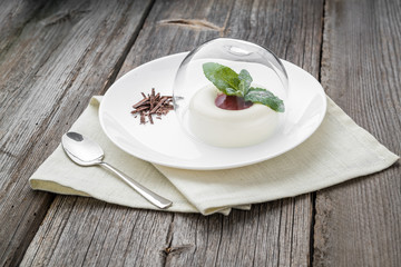 dessert named panacota. With chocolate and jam