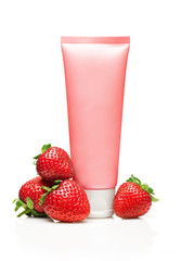 Red cosmetic tube with strawberry on white background