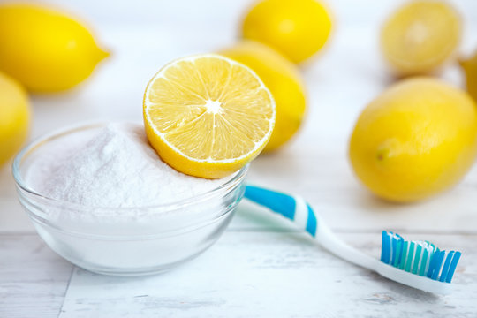 Lemon on baking soda in bowl