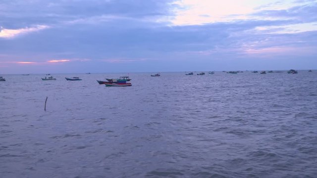 The village in Vietnam. The island in Vietnam. Boats on pier. Vietnam. Village of fishermen. Pier with fishing boats at a pier. raditional Vietnamese boats after fishing at a pier