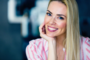 Portrait of cheerful young beautiful blonde woman