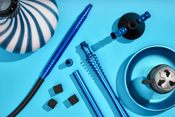 Top view of Hookah parts on light blue background