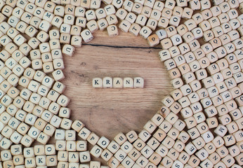 Krank Buchstaben Würfel auf einem Holzbrett