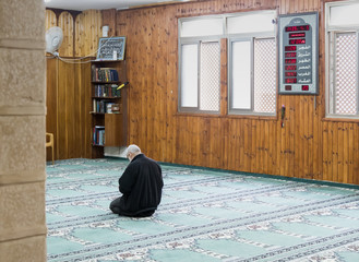 A believing muslim prays in The White Mosque - Al-Abiad in the old city of Nazareth in Israel