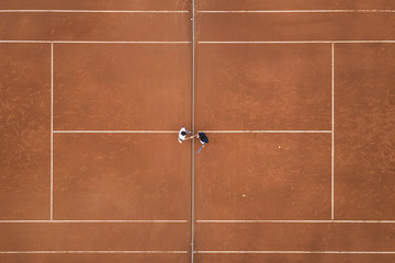 Aerial photo of a tennis match on clay court, handshake of the players