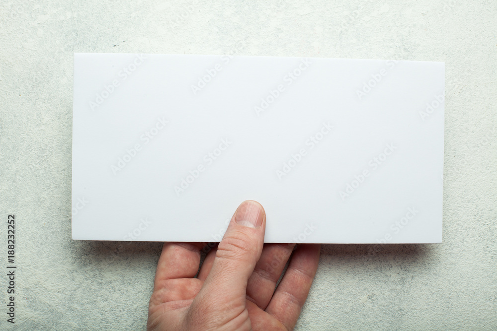 Poster an empty booklet pamphlet or an envelope for writing in his hand. presentation of leaflets. leaf pat