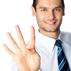 Businessman showing four fingers, isolated