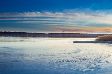 Winter paysage landscape of sunset evening iced frozen lake