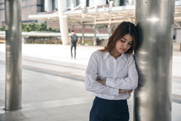 Portraits of beautiful asian woman stressed from work.