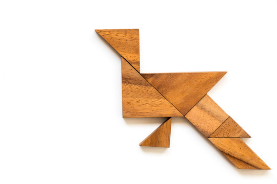 Wood tangram puzzle in peacock shape on white background