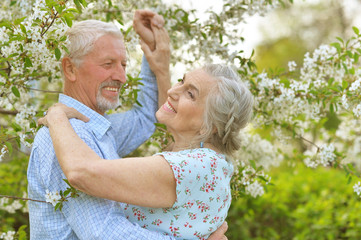 Outdoor portrait of happy senior couple dancing 