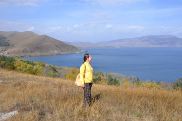A woman looks at Lake Sevan. Armenia