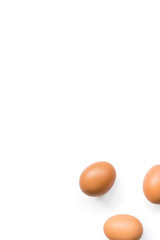 fresh brown organic chicken eggs isolated on white background. Vertical composition. Top view
