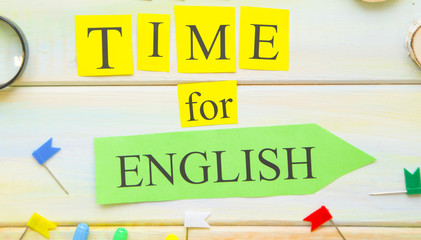 Learning Foreign Languages concept: It's Time For English inscription and bright school supplies on...