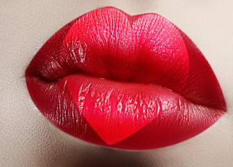 Valentine Heart on beautiful female Lips. Sweet Kiss. Love Makeup for Valntines Day. Shape Heart like Symbol of Love