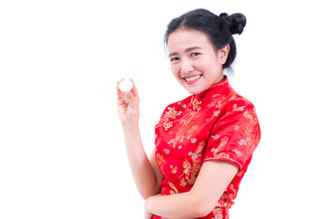 Beautiful Young asian woman wearing chinese dress traditional cheongsam or qipao with hand holding golden Bitcoin isolated on white background. Chinese New Year Festivities, Electronic money concept