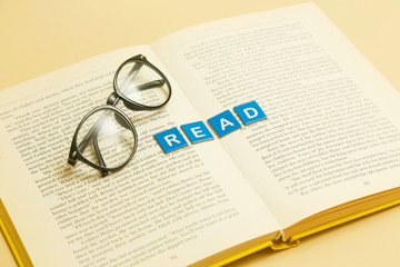 Reading glasses and book - love reading concept