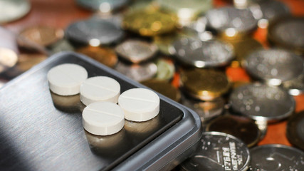 Obraz na płótnie Canvas Laboratory scales. Pills and medication.