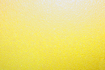 Yellow textured background. Bright cheerful pastel yellow, perfect for springtime, summer or Easter theme. 