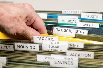 Home filing system for taxes organized in folders