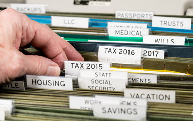 Home filing system for taxes organized in folders