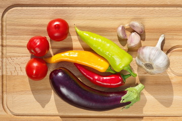 Fresh vegetables on wooden cutting Board