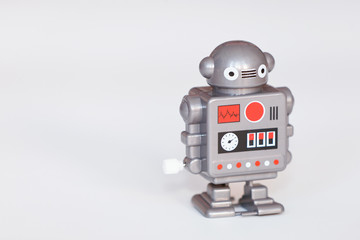 toy robot figure isolated on bright background