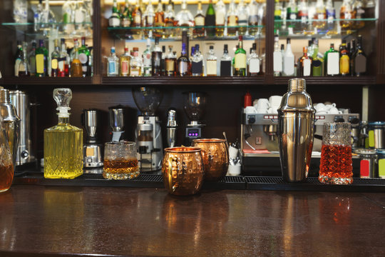 Creative alcoholic cocktails assortment on bar