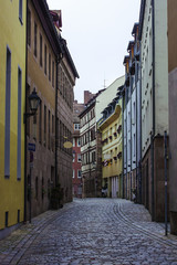 Old street in Bavarian city Nuremberg with houses different colors. Nurnberg, Germany