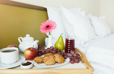 Breakfast served in bed on wooden tray