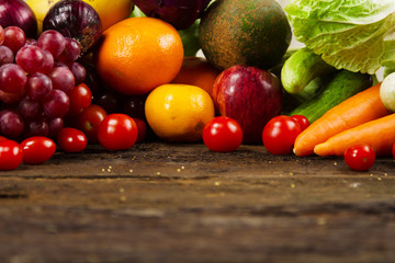 Fresh vegetable and fruit on wood desk at kitchen prepare for cook by chef. vegetarian, salad bar, healthy food and fresh food concept.
